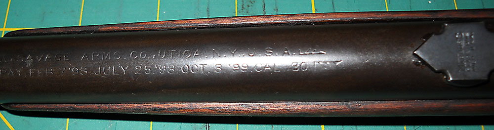 detail view of Savage 99 barrel top roll stamping